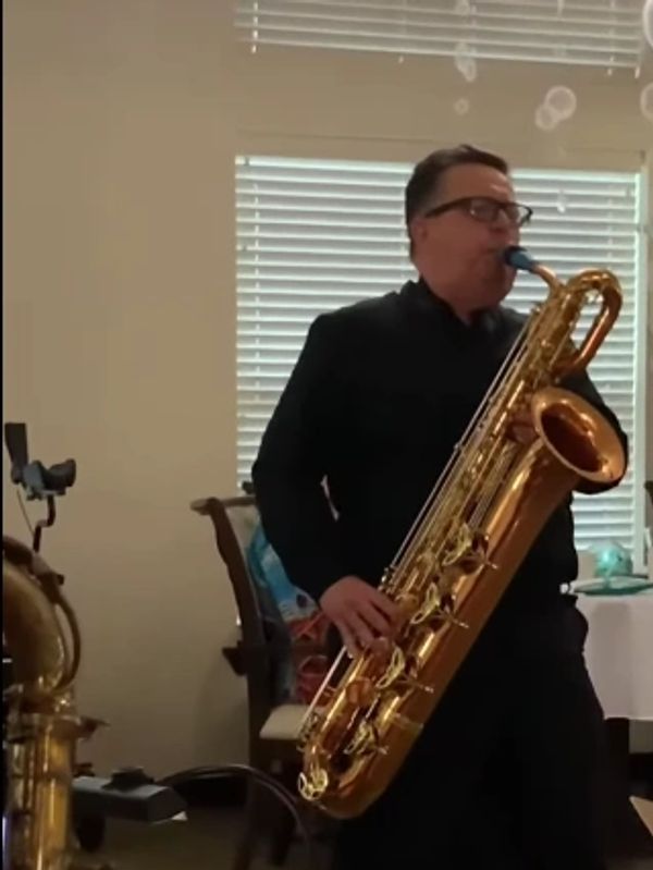 Jack Skorija, Gig Rig inventor, playing a baritone saxophone.